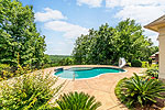 Sparkling pool with mountain top and golf course views at 156 Walnut Point Drive in Emerald Mountain, Wetumpka, AL. Professional photos and tour by Go2REasssistant.com