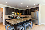 Kitchen with huge granite breakfast bar island at 290 Bon Terre Blvd. in Bon Terre, Pike Road, AL. Professional photos and tour by Go2REasssistant.com