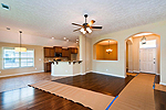 Greatroom looking toward Dining Room & Kitchen in the Westminster-Laurel-St Joe Floor Plan, Lowder New Homes, Montgomery, AL. Professional photos and tour by Go2REasssistant.com