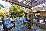 Outdoor living at it's best with arbor covered deck and huge screened porch at historic Rose Hill Plantation 1949 Cottage, Montgomery, AL. Professional photos and tour by Go2REasssistant.com